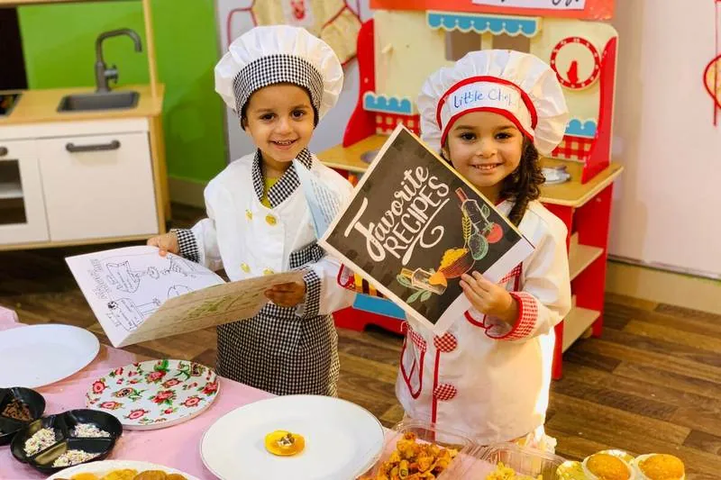Little chefs at the play kitchen